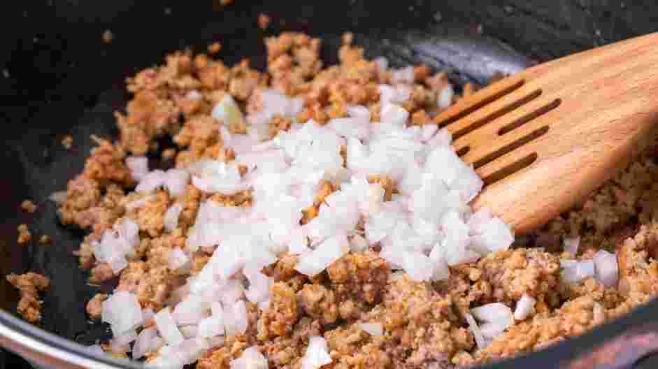 Totchos Recipe: Add the diced onions to the skillet and cook until softened, about 4 minutes.