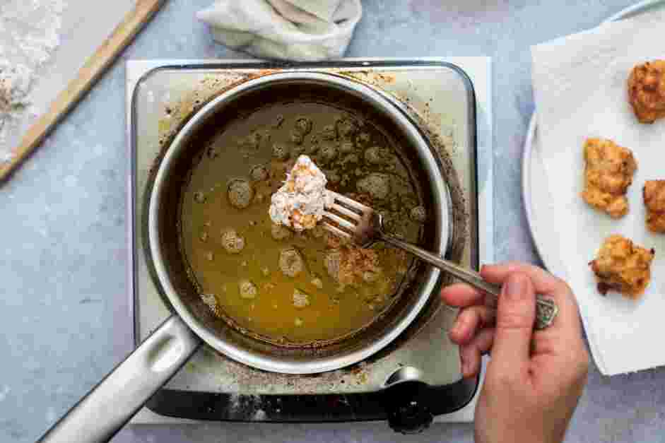 Vegan Fried Chicken Recipe: In a heavy-bottomed pot, add enough vegetable oil to fully submerge several pieces of tofu.