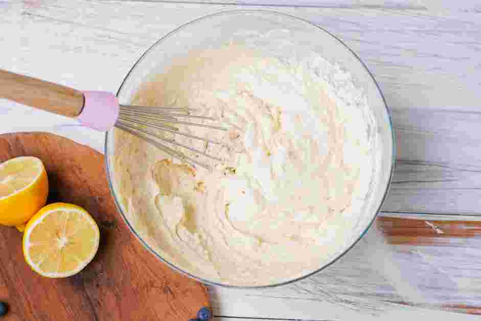 Lemon Blueberry Pound Cake Recipe: Add the remaining flour mixture, then the rest of the milk mixture, and mix until smooth.