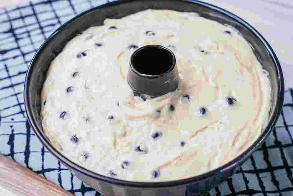 Lemon Blueberry Pound Cake Recipe: Transfer the batter into a well-oiled Bundt pan and bake for about 45 minutes or until the top is golden brown and a toothpick or knife tip inserted in the center comes out clean.