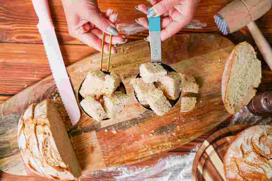 How to Make Breadcrumbs Step 2: Next, cut each individual bread slice into rough 1-inch cubes.