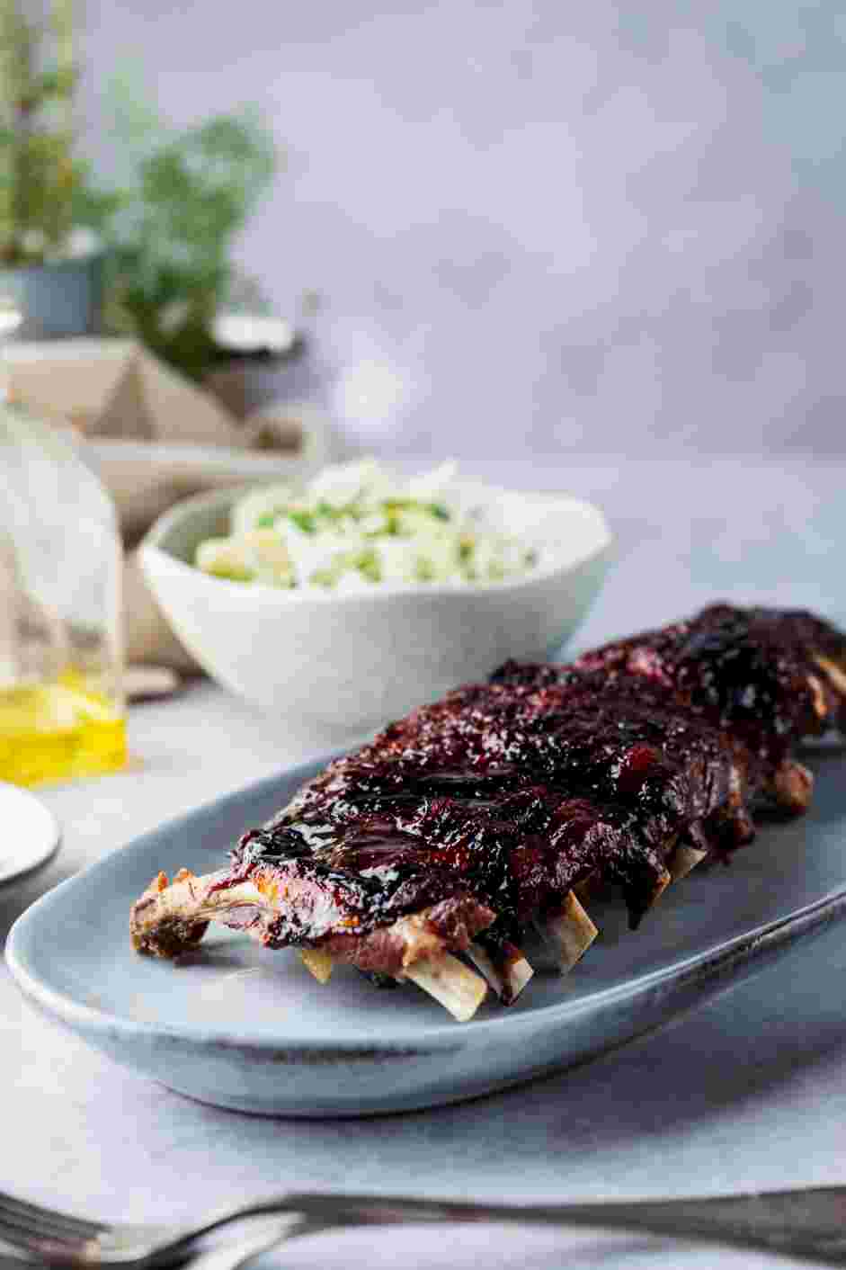 Smoked Baby Back Ribs with Blueberry BBQ Sauce Recipe: Serve with extra blueberry barbecue sauce and fennel slaw.