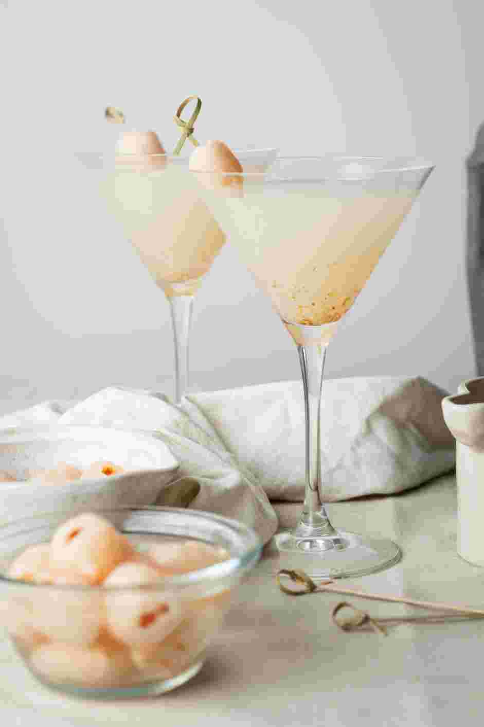 Lychee Martini Recipe: Skewer two lychees on a skewer for garnish.