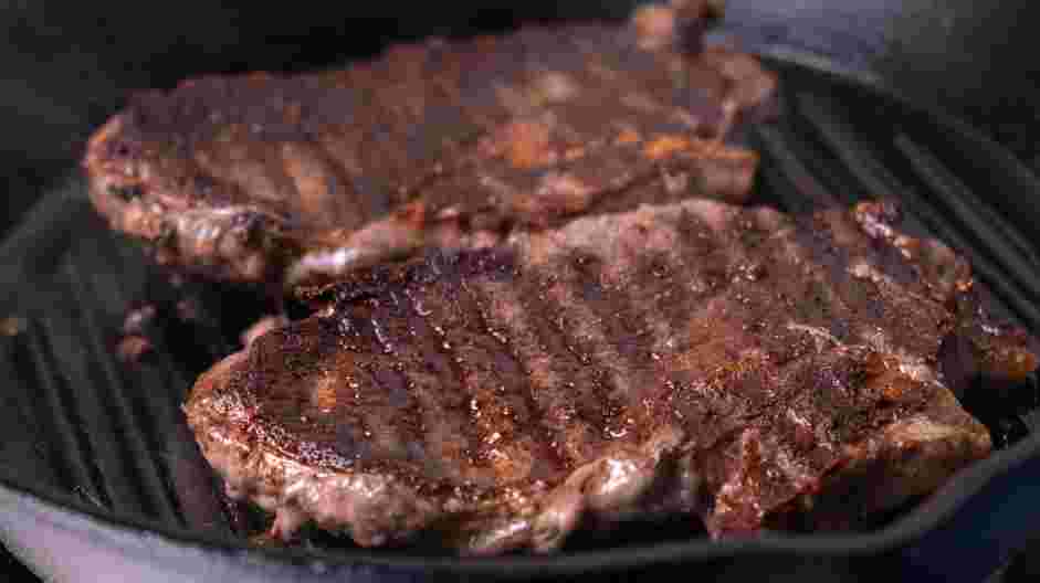 Cowboy Steak with Pan-Fried Radish and Bacon Recipe: Preheat a cast-iron pan and add oil.