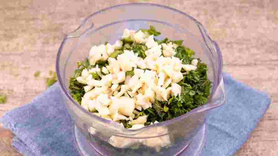 Red Chimichurri Recipe: In the bowl of a food processor, place the parsley, cilantro, radish greens, and garlic.