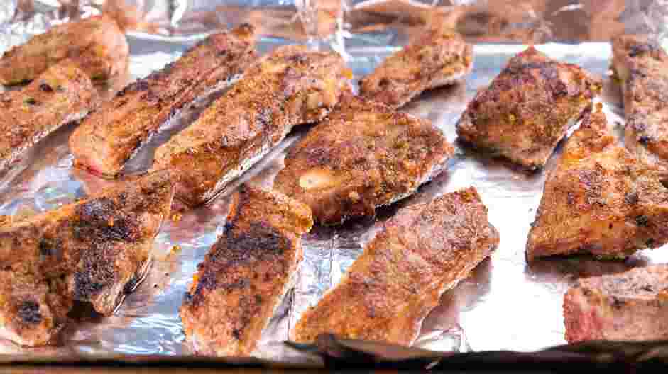 Rib Tips Recipe: Place the seared rib tips on a sheet pan lined with aluminum foil and add the water to the sheet pan.