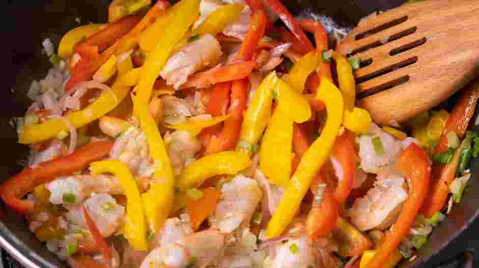 Shrimp Fajitas Recipe: Add the shrimp, salsa, the juice of one lime, lemon juice, cherry tomatoes, yellow and red bell peppers, scallions and hot sauce.