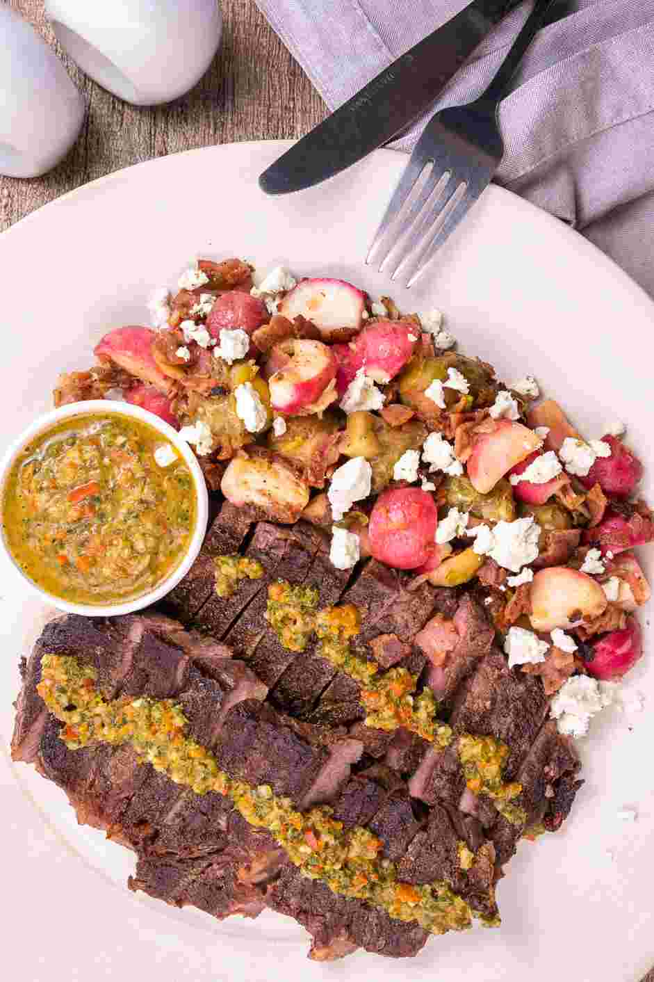 Cowboy Steak with Pan-Fried Radish and Bacon Recipe: 
To plate, place the pan-fried radish and bacon on the plate, then the ribeye.