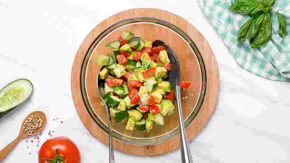 Cucumber Tomato Avocado Salad Recipe: Place the chopped vegetables into a mixing bowl.