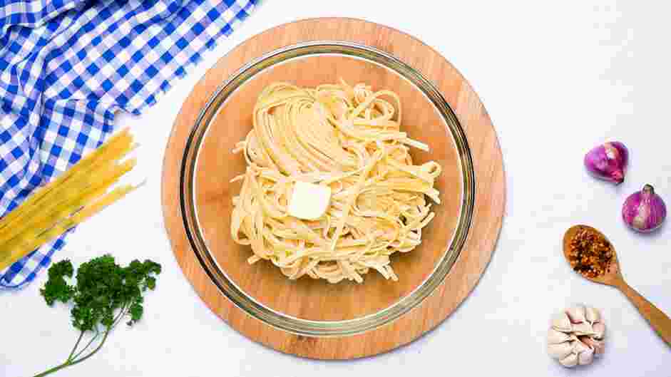 Scallop Scampi with Linguini Recipe: Drain the water and toss with the butter until evenly coated.