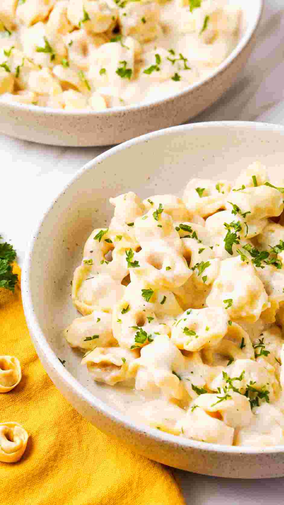 Tortellini Alfredo Recipe: Garnish with parsley and serve.