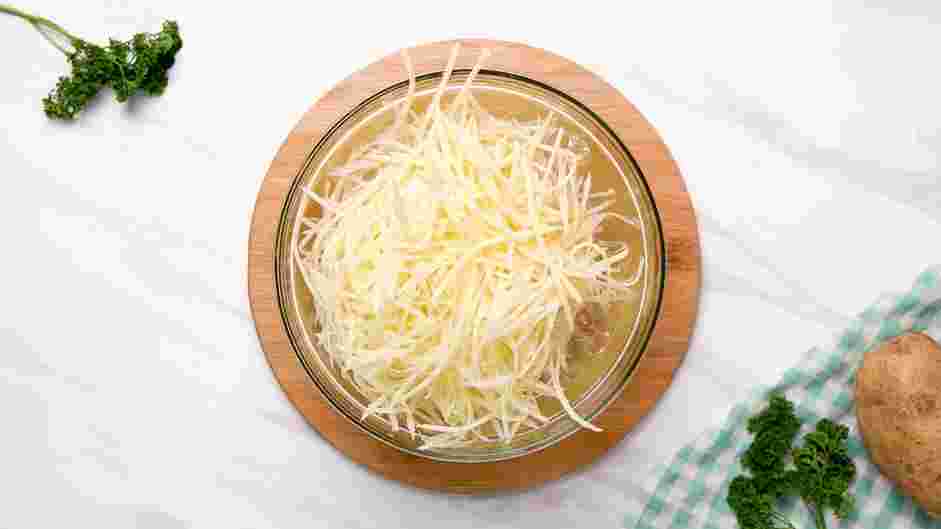 Shoestring Fries Recipe: Place the sliced potatoes into the ice water and let them soak for at least 20-30 minutes.