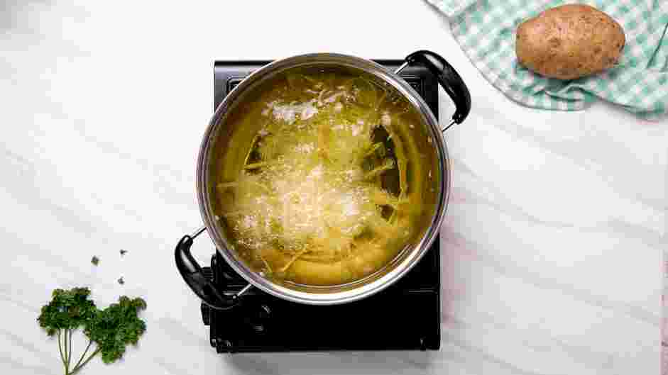 Shoestring Fries Recipe: In a Dutch oven or a heavy-bottomed pot, heat at least 4-5 inches of oil to 350°F.