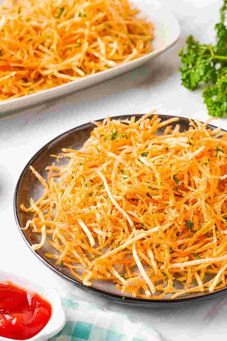 Shoestring Fries Recipe: Garnish with parsley and serve with ketchup or your favorite dipping sauce.