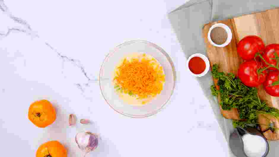 Corn Nuggets Recipe: Add the creamed corn, corn kernels, jalape&ntilde;o peppers and shredded cheddar cheese to the buttermilk mixture and whisk until well combined.