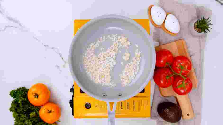 Tomato Gravy Recipe: Turn the heat to medium-low and add the finely diced onions to the skillet.