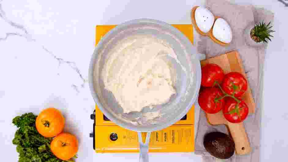 Tomato Gravy Recipe: Slowly drizzle in the chicken stock while constantly whisking to avoid clumps.