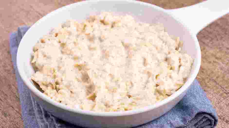 Hot Artichoke Dip Recipe: Transfer the mixture to a small baking dish and sprinkle the top with the panko (or plain breadcrumbs).