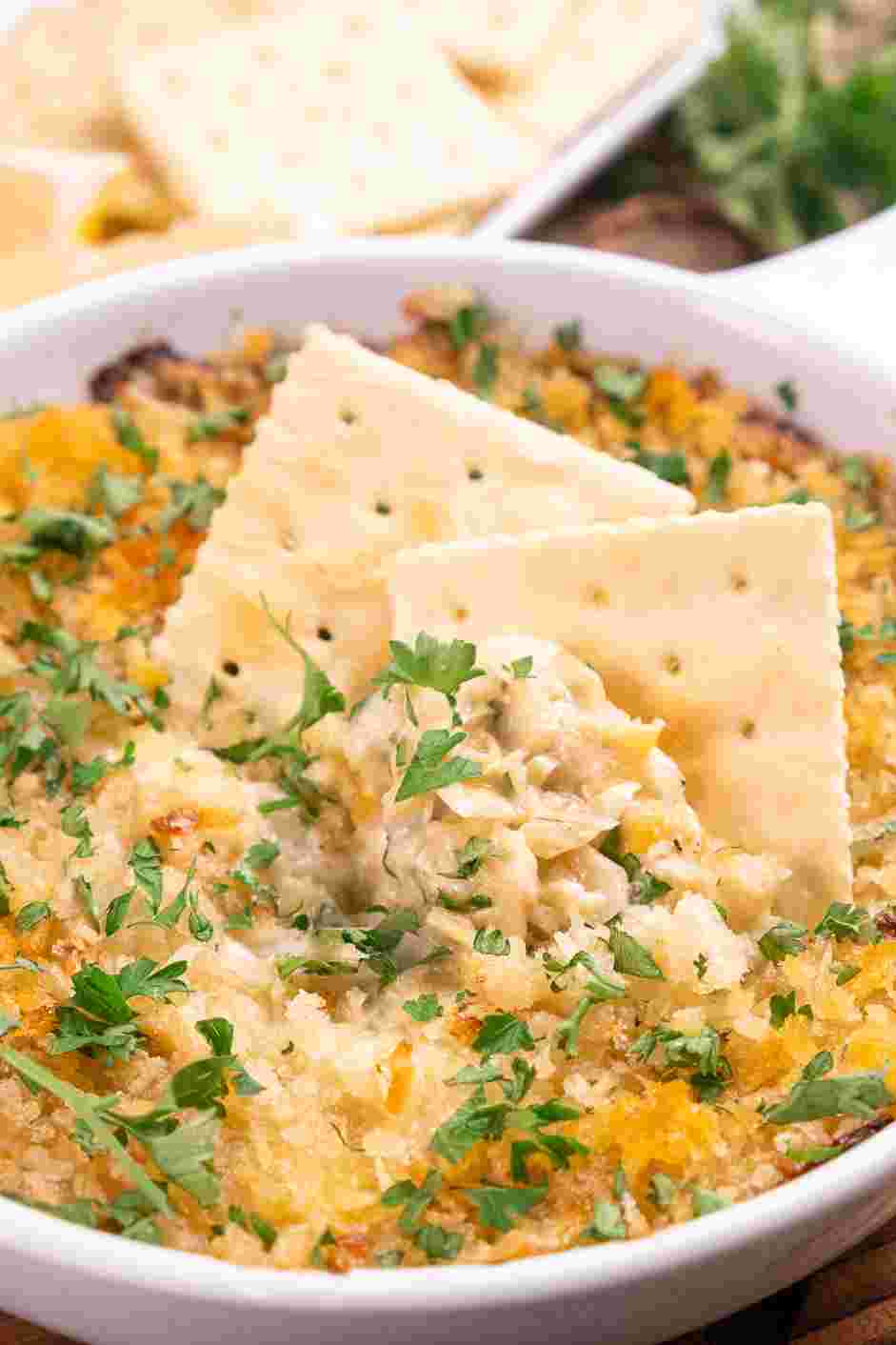 Hot Artichoke Dip Recipe: Serve warm with crackers or crostini.