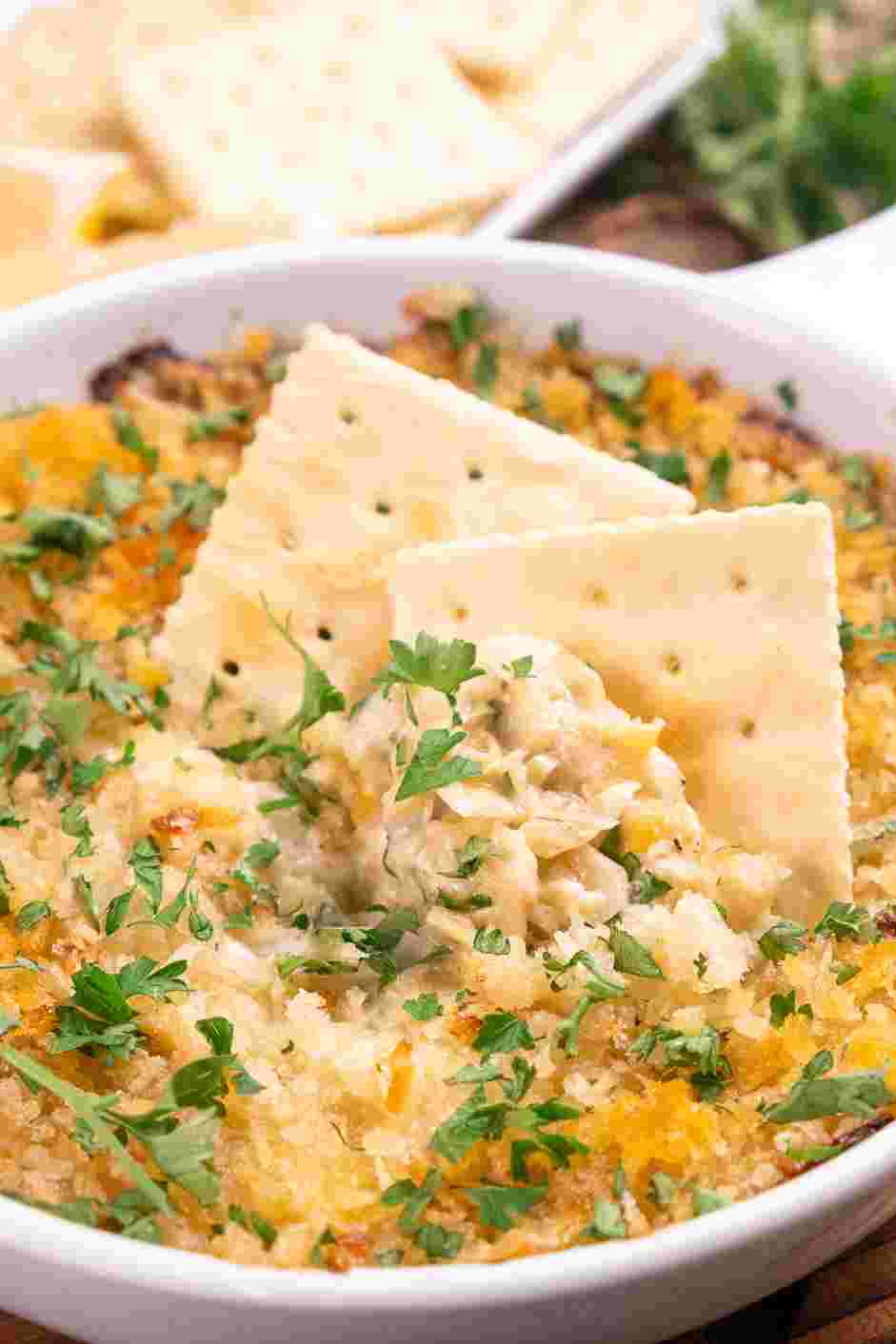 Hot Artichoke Dip Recipe: Serve warm with crackers or crostini.