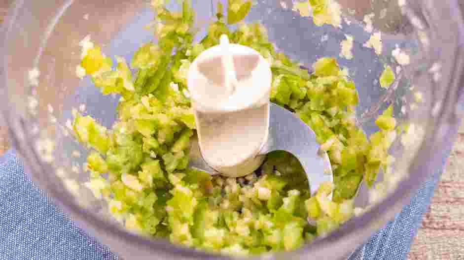 Schug (Skug, Skhug or Zhug) Recipe: In the bowl of a food processor, add the garlic cloves, green chiles and habanero peppers.