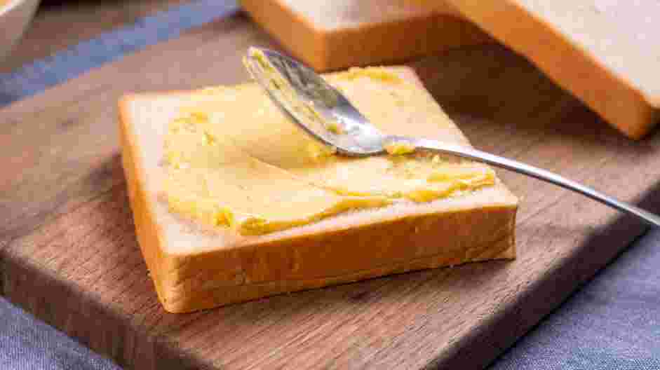 Texas Toast Garlic Bread Recipe: Butter each slice of toast with the softened garlic butter.