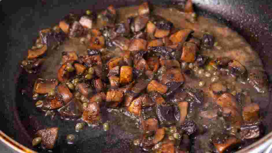 Veal Scallopini Recipe: Add the dry wine to deglaze the skillet, scraping up any browned bits.