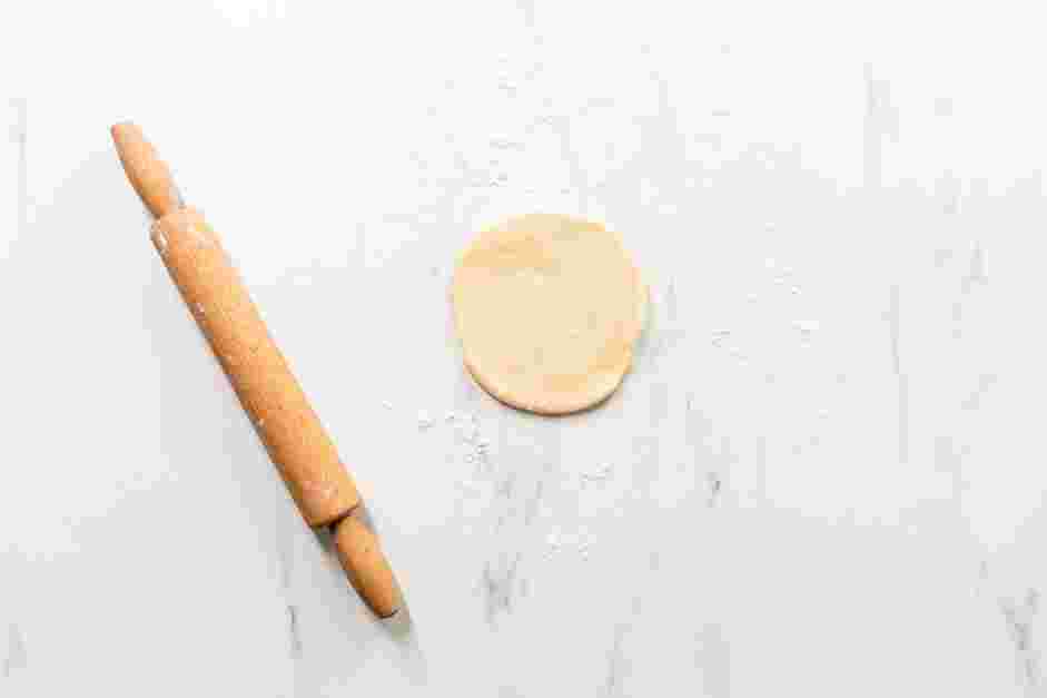 Fried Dough Recipe: Use a rolling pin to roll out each piece of dough to a ½-inch thick disc.