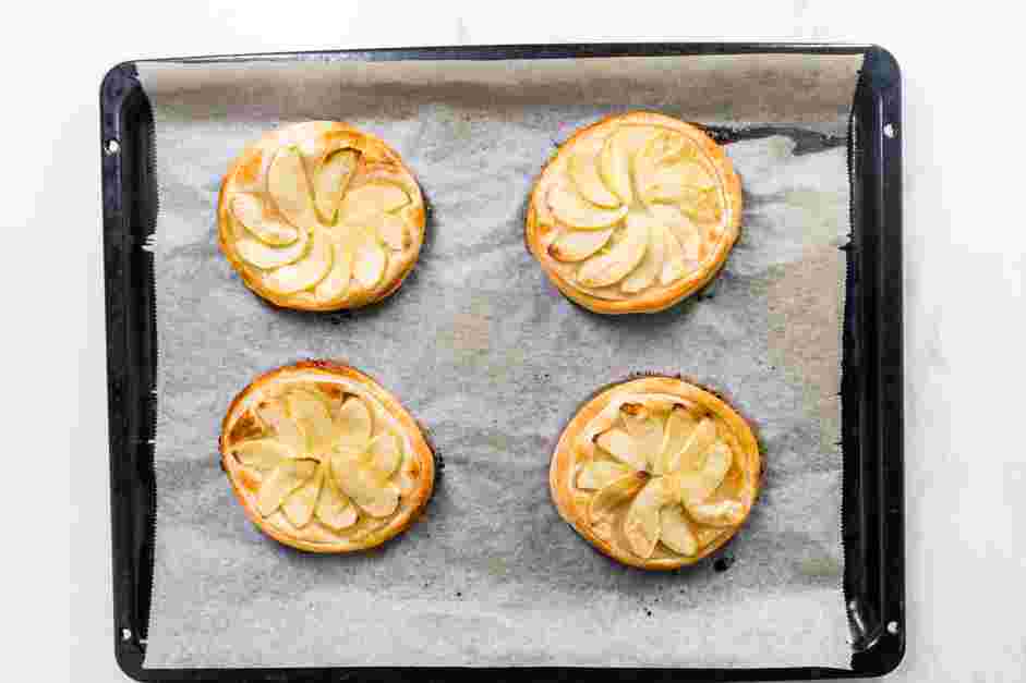 Apple Tartlets Recipe: Bake for 20-30 minutes until the apples are tender and the pastry is golden brown.