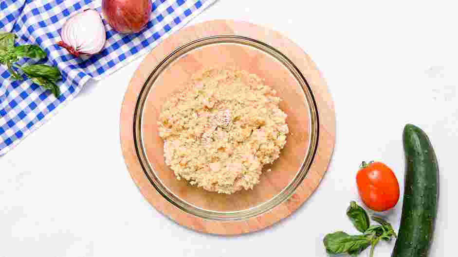 Quinoa Salad with Feta Recipe: Transfer cooked quinoa to a large bowl.