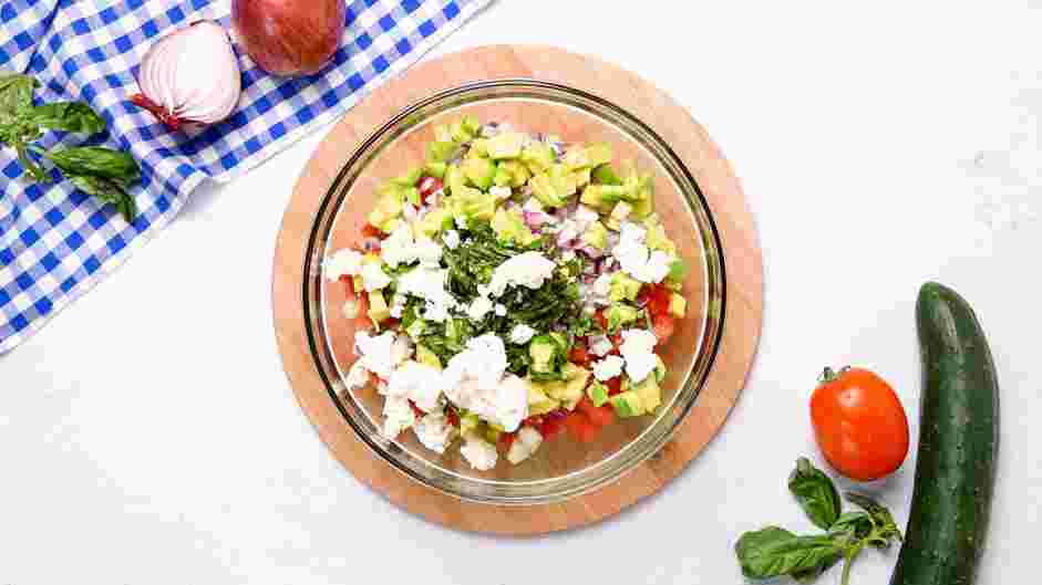 Quinoa Salad with Feta Recipe: Add the diced tomatoes, diced cucumbers, diced red onions (or scallions), diced avocados, chopped fresh basil and crumbled feta.