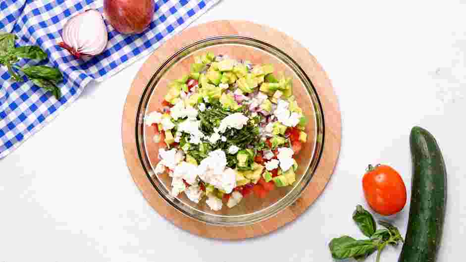 Quinoa Salad with Feta Recipe: Add the diced tomatoes, diced cucumbers, diced red onions&nbsp;(or scallions), diced avocados, chopped fresh basil and crumbled feta.