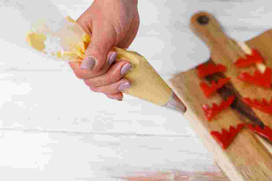 Halloween Deviled Eggs Recipe: Transfer one bowl&rsquo;s worth of the deviled egg filling into a piping bag fitted with an open star tip.