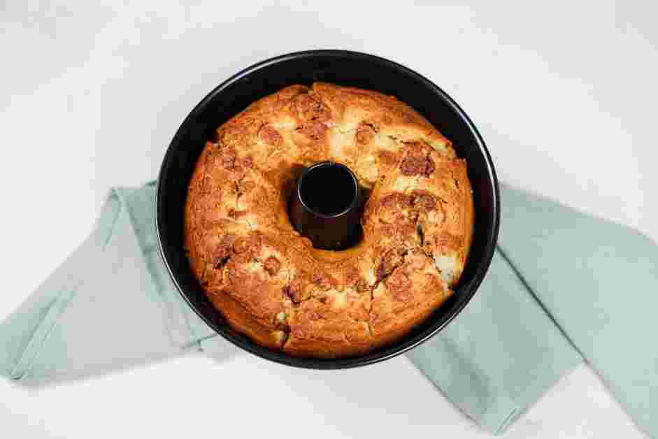 Honey Bun Cake Recipe: Let the cake cool in the pan for 15 minutes before removing the cake from the pan onto a wire rack to cool completely.