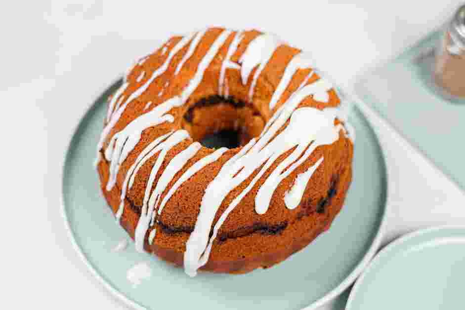 Honey Bun Cake Recipe: Drizzle the vanilla icing over the cooled cake.