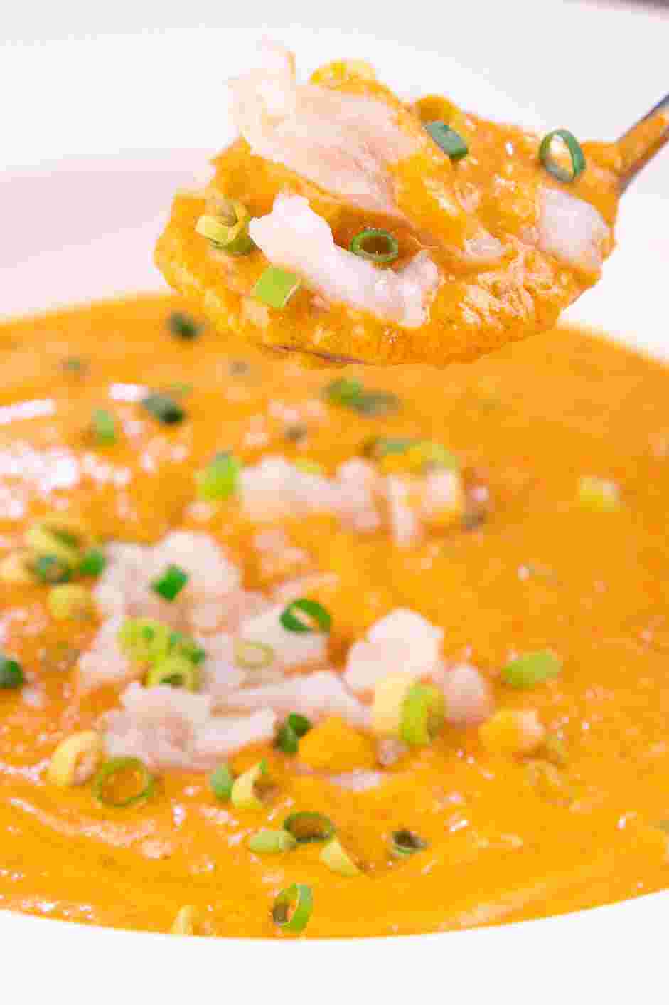 Cream of Crab Soup Recipe: Top the soup with the crab and garnish with the chopped chives.