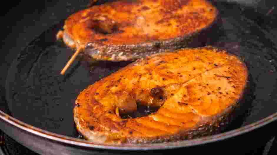 Salmon Steaks with Roasted Chile Medley and Turmeric Rice Recipe: Cook the salmon steaks for 2-3 minutes per side, until slightly browned.