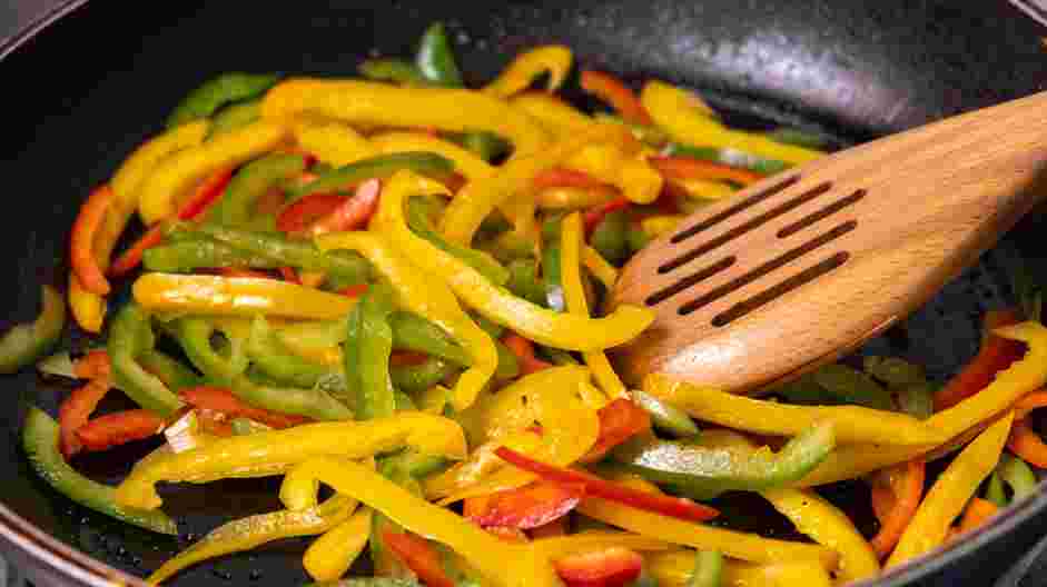 Salmon Steaks with Roasted Chile Medley and Turmeric Rice Recipe: Raise the heat to medium-high and add the yellow bell peppers, poblano peppers and red jalapeños to the pan.