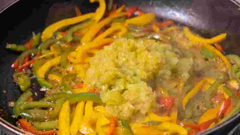 Salmon Steaks with Roasted Chile Medley and Turmeric Rice Recipe: Add butter, blended tomatillos and grated garlic to the pan.