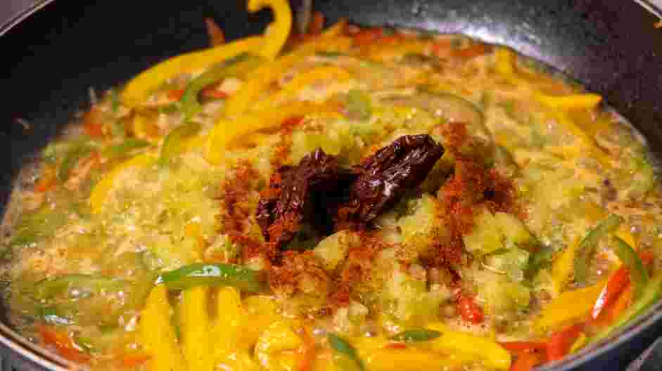 Salmon Steaks with Roasted Chile Medley and Turmeric Rice Recipe: Add water, tomato bullion and chipotle peppers.