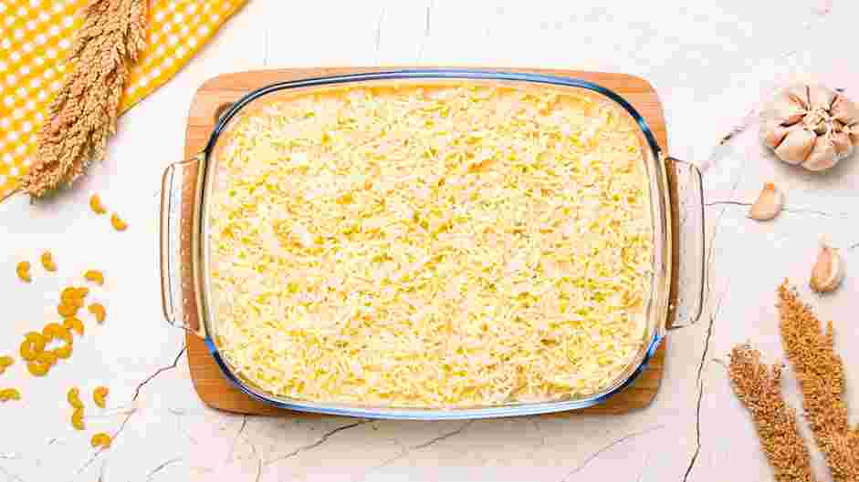 Gouda Mac and Cheese Recipe: Pour the cheese sauce over the noodles, stir and add grated Gouda and mozzarella (or cheddar) cheese to the top.