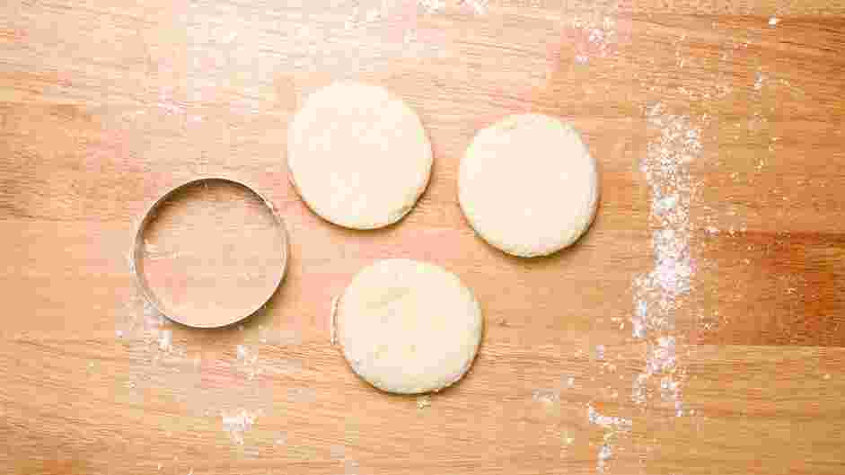 Honey Butter Chicken Biscuit Recipe: Roll out the biscuit dough to an even one-inch round thickness.