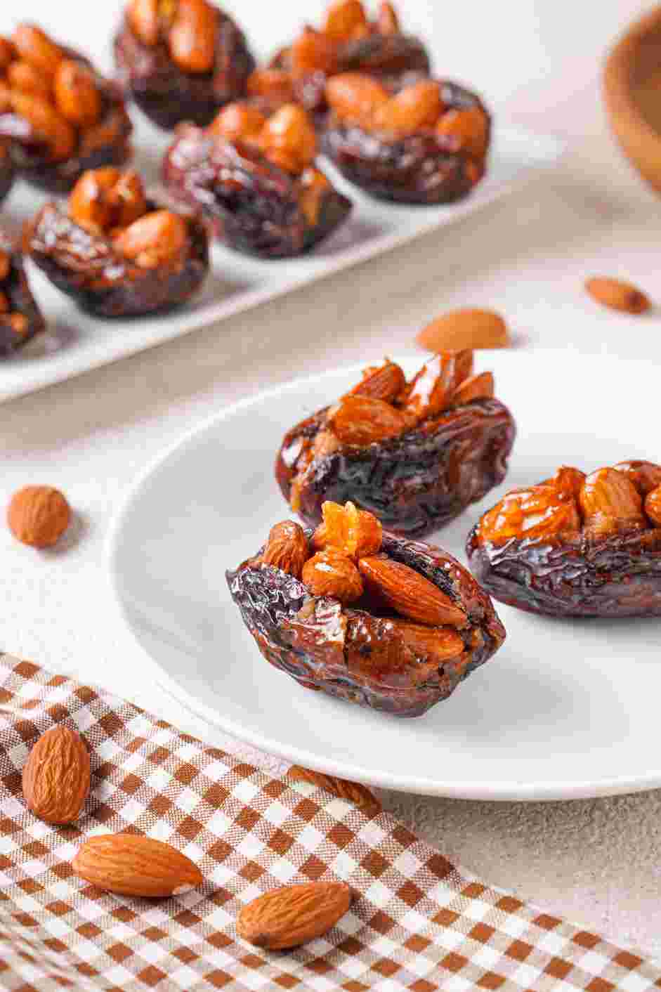 Stuffed Dates Recipe: Let excess syrup drip and transfer your stuffed dates to a serving plate.