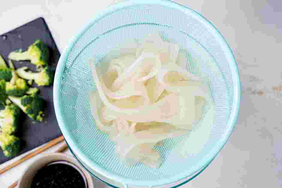 Pad See Ew Recipe: Once the noodles are done soaking, drain the noodles and set them aside.