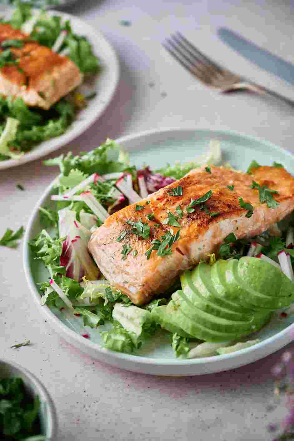 Sous Vide Salmon Recipe: Garnish with chopped parsley and serve immediately with lemon wedges.