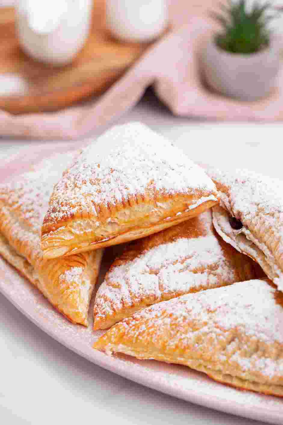 Cherry Turnovers Recipe: Dust pastries with powdered sugar before serving.