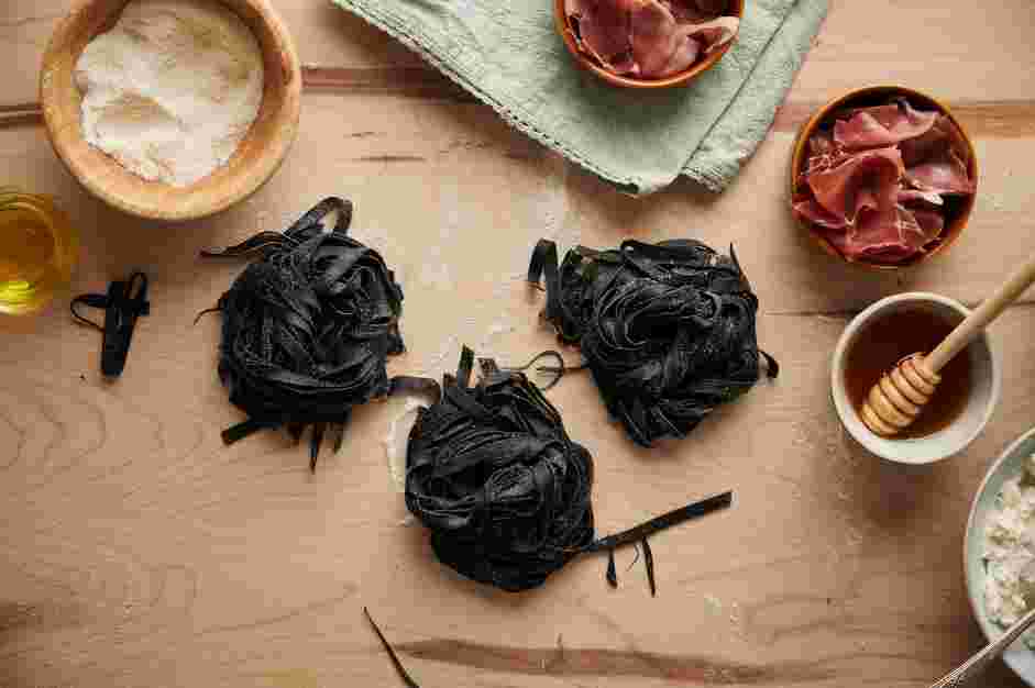 Squid Ink Pasta with Crispy Prosciutto and Truffle Honey Recipe: Once all your pasta is done, cut to the desired shape with a knife or pasta cutter.