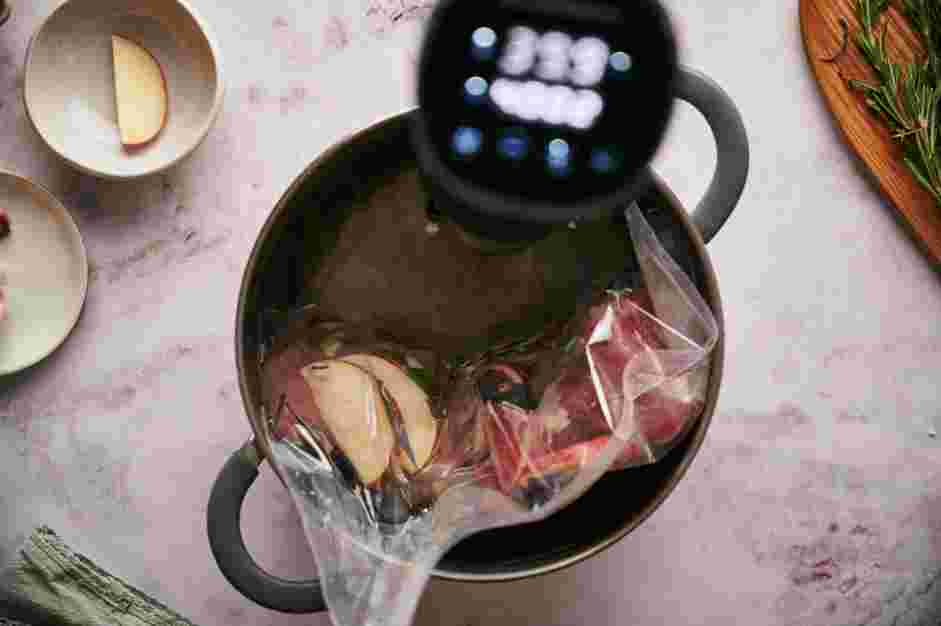 Sous Vide Pork Tenderloin Recipe: Submerge the vacuum-sealed pork tenderloin into the sous vide water bath.