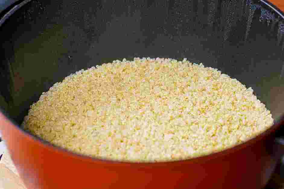 How to Cook Quinoa Step 4: Cook, covered, for 15 minutes or until most of the liquid in the pan has disappeared and steam holes appear on the surface.