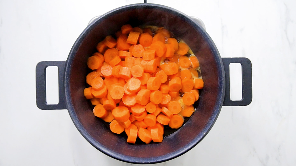 Candied Carrots Recipe: In a large saucepan, combine the sliced carrots and the water.